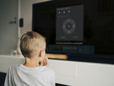 A boy waits as his parent uses Firestick parental controls to activate FreeTime.