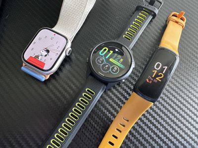 Apple Watch Series 9, Garmin Forerunner 265, Fitbit Inspire 3 fitness trackers.