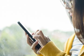 A woman using an Android phone