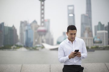 Businessman using phone with Shanghai cityscape : Stock Photo View similar imagesMore from this photographerDownload comp Businessman using phone with Shanghai cityscape