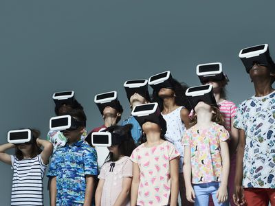 Group of children wearing virtual reality headsets