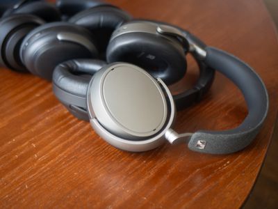 A few sets of headphones on a table.