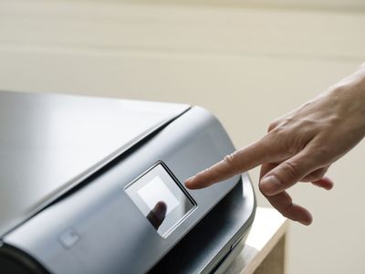 Image of someone setting up a printer