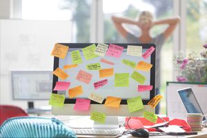 Image of a computer screen covered with sticky notes