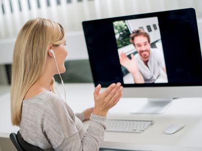 Woman and friend using Skype